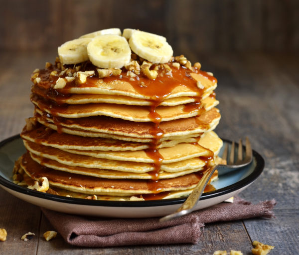 Pancakes with banana,walnut and caramel for a breakfast.